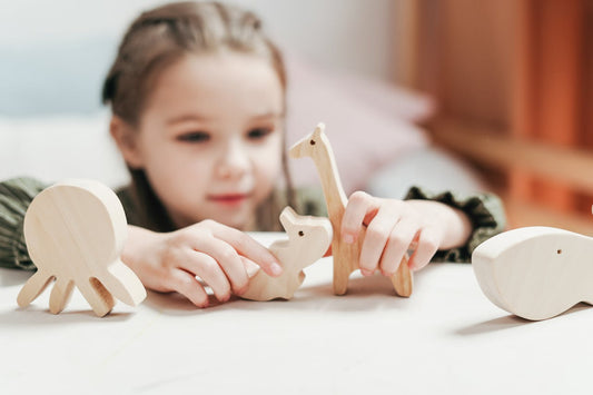 A girl playing with wooden toys