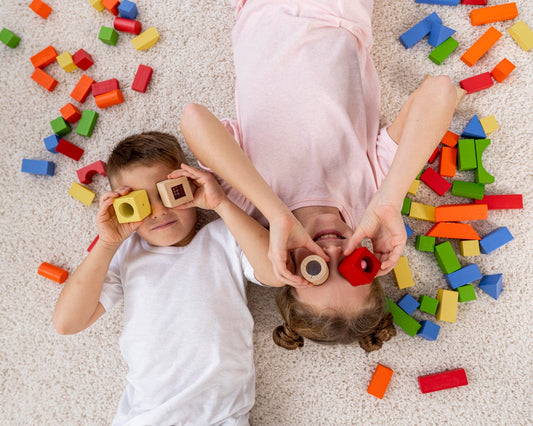 two kids playing with blocks
