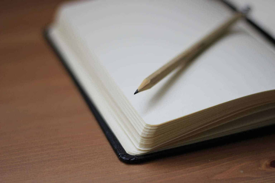 journal with a pencil