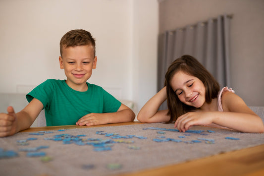 Kids doing an emotional town puzzle together