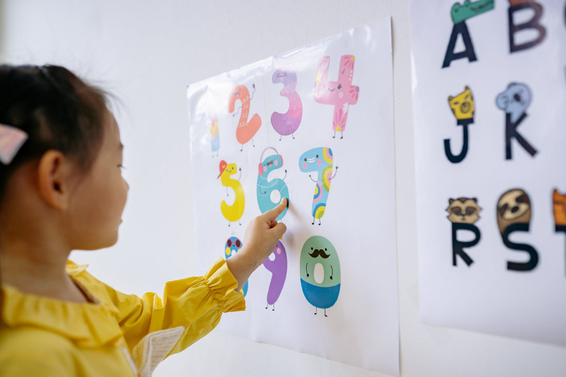 Child pointing at numbers